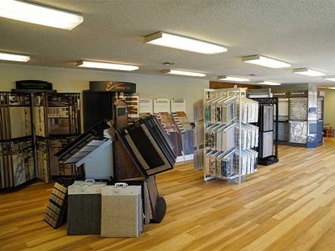 Store interior including several window covering and fabric samples